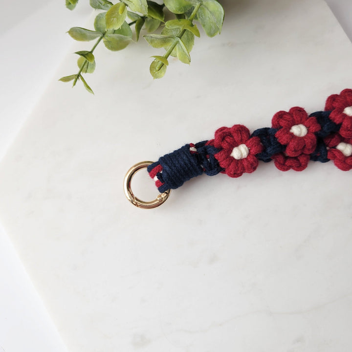 Blue and Maroon Flower Macrame Wristlet Keychain, with a close up of the gold clip.