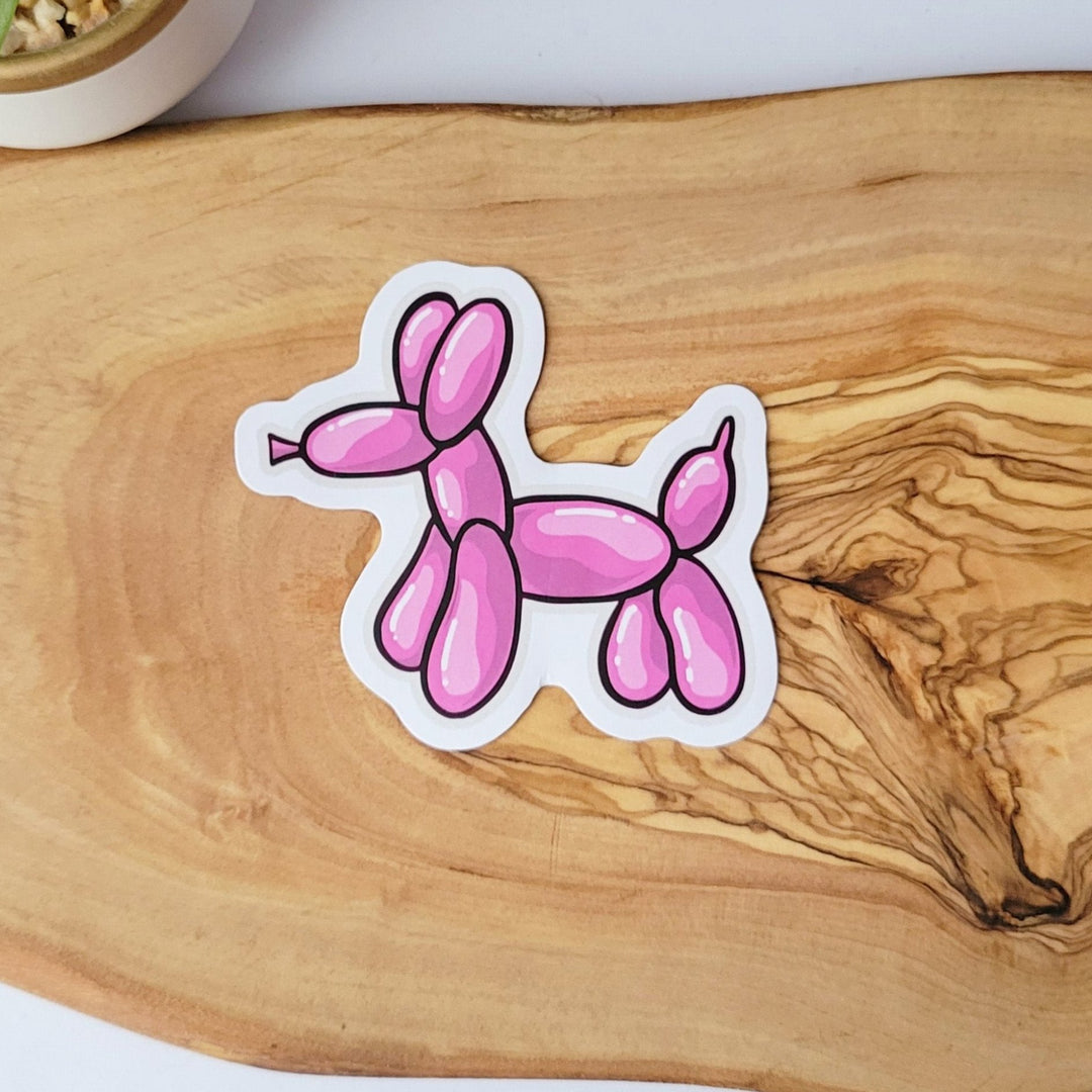 a pink balloon dog with multiple pink and white highlights