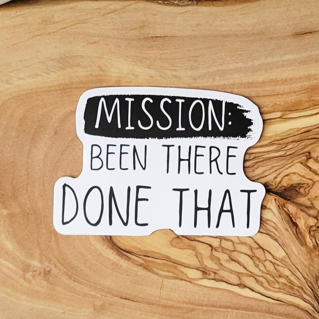 A white sticker with "Mission: Been There Done That"