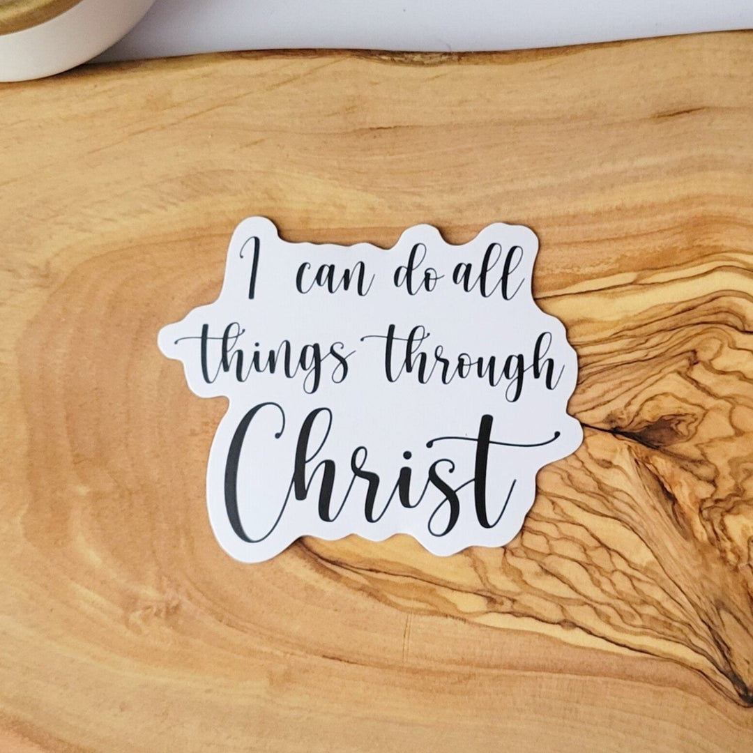 White sticker with the words "I can do all things through Christ" in black cursive lettering
