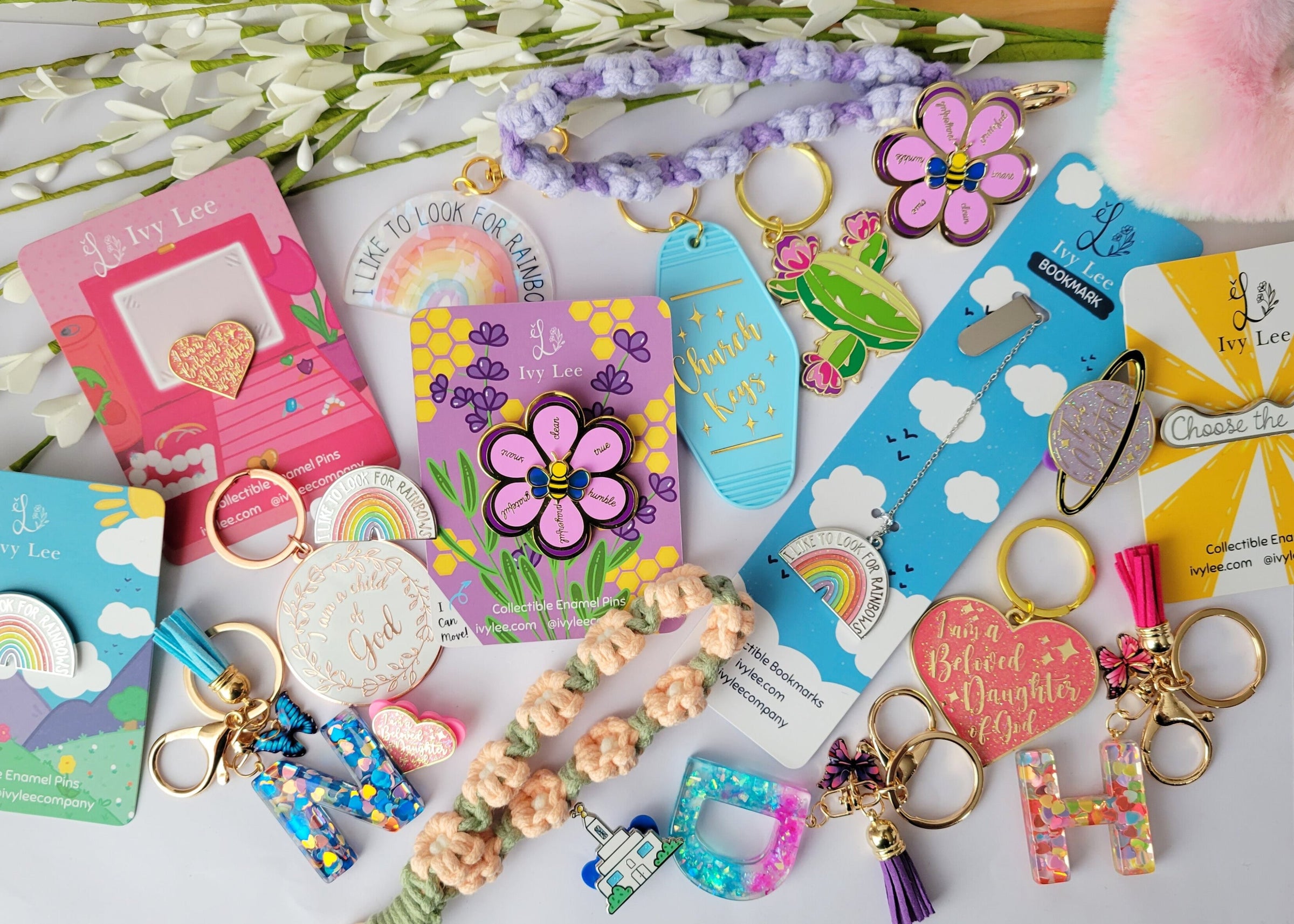 large assortment of keychains, enamel pins, and other accessories