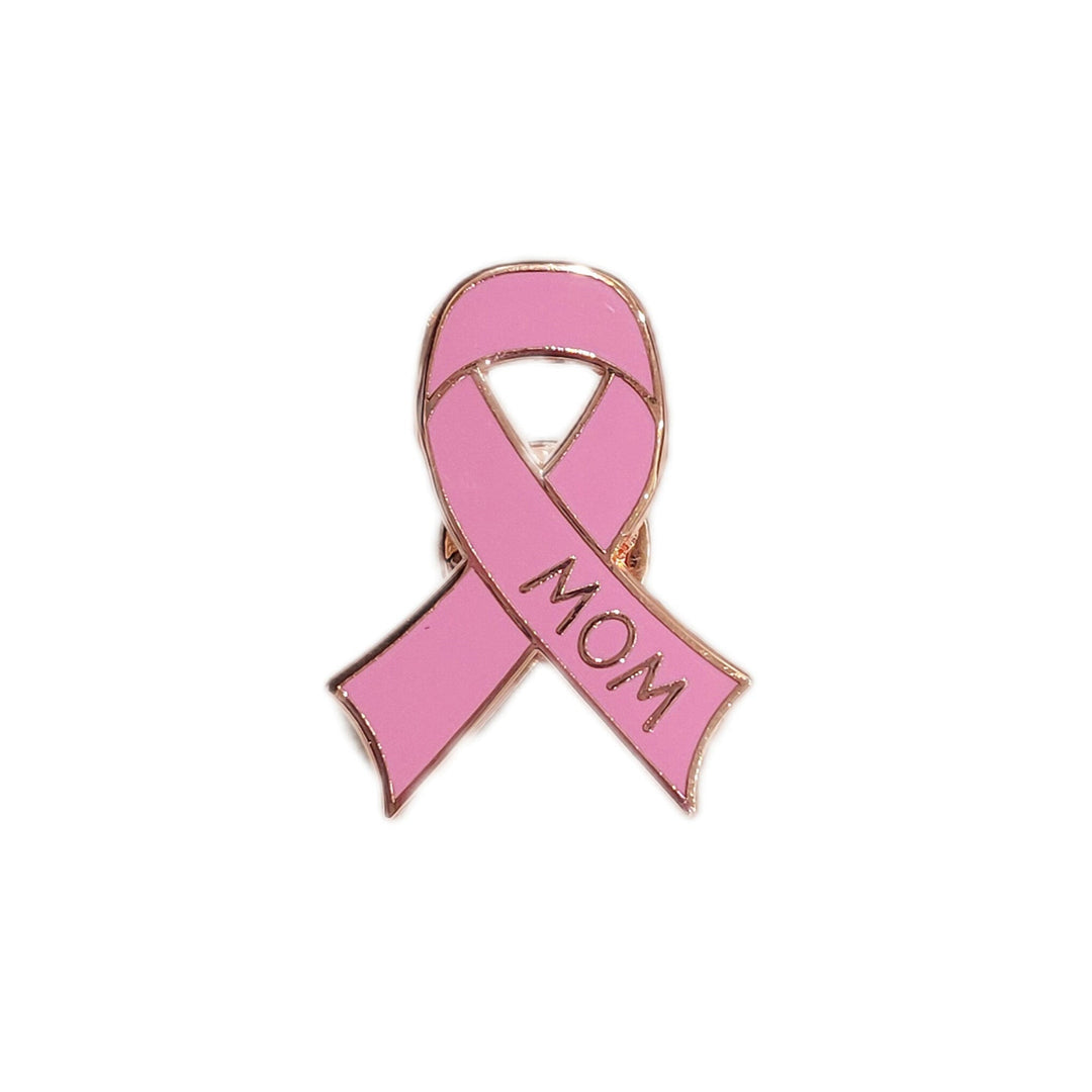 pink cancer ribbon shaped pin on white background