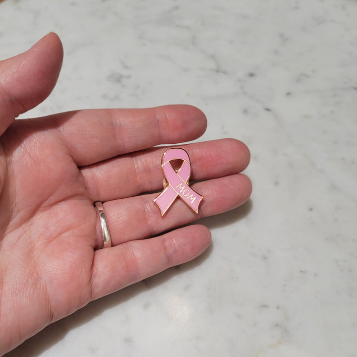 Pin on an outstretched hand
