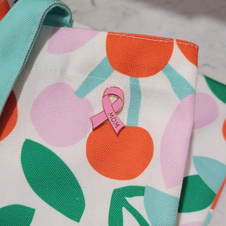 one cancer ribbon pin on a bag