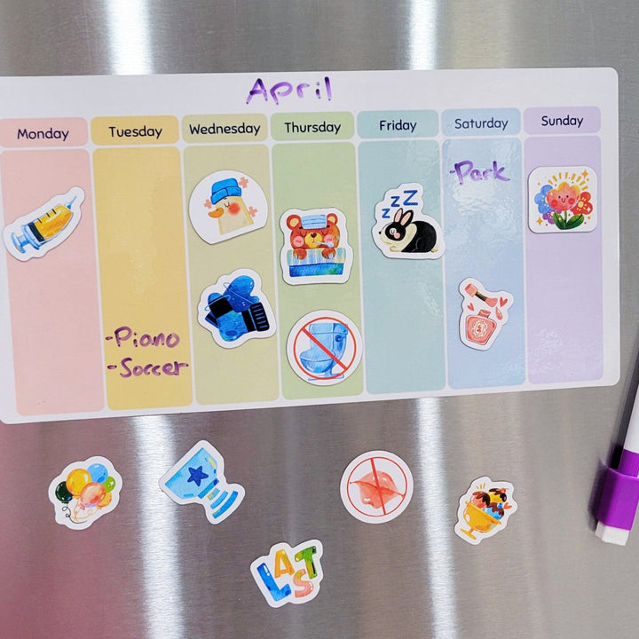 Magnetic calendar and stickers on a refrigerator door